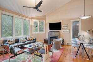 Living room features a fireplace and TV.