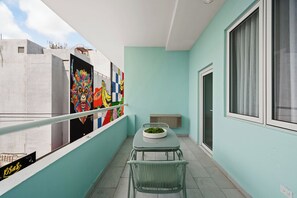 Balcony with dining table.