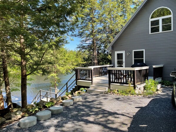 Entrance to the cabin has a deck with access to the water. 