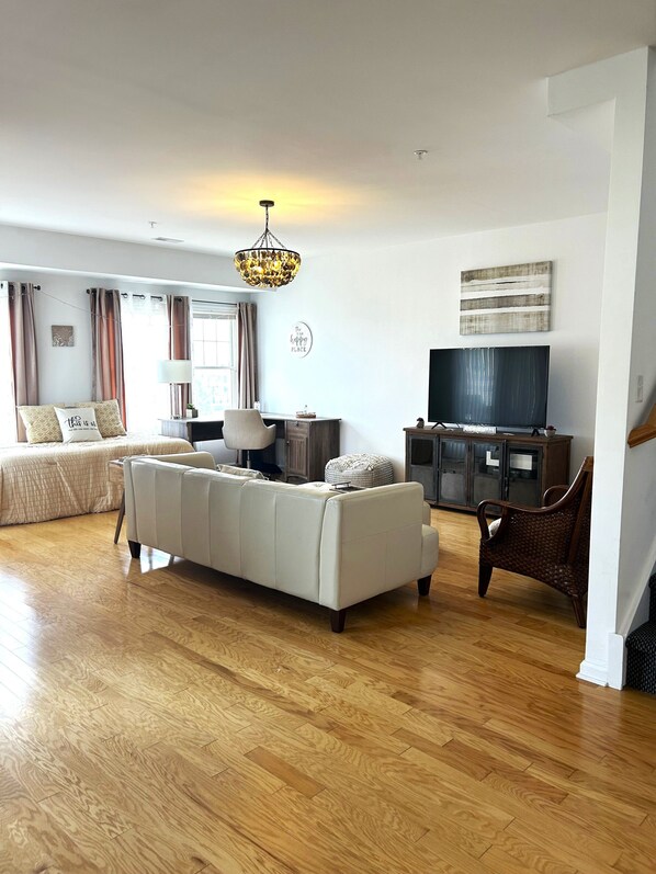 Bright and open living room for relaxation and gatherings with a coastal charm!