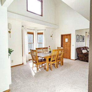Large dining room table.  Great view of the backyard and sunrises!