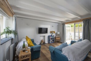 Bowjy Cottage, St Agnes. Ground Floor: The cosy sitting room, beautifully furnished.