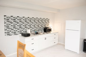 Kitchen area with Fridge