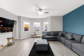 Modern living room with a smart TV and streaming services, perfect for unwinding after a long day exploring the city.
