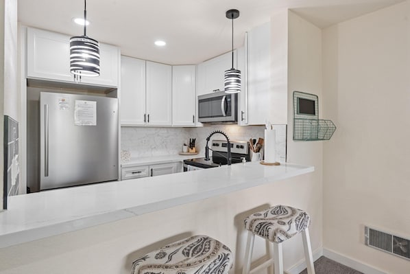 Recently remodeled kitchen with stainless steel appliances