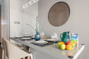 Dining Area: Enjoy lavish meals in this stylish space, complete with a chic centerpiece and vibrant views!