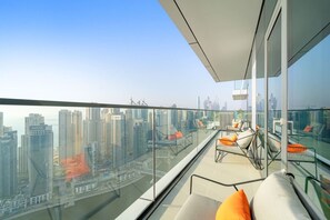 Balcony Bliss: Enjoy breathtaking skyline views from your stylish lounge area!