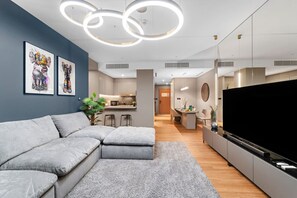 Living Room: Chic artworks and modern flair create the perfect space to unwind in style!