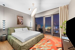 Bedroom: Unwind with stunning skyline views and chic decor from your urban oasis!
