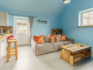 Well-furnished living area | The Cowshed - Musselwick Farm, St Brides