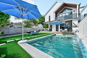 Private heated pool with waterfall and lots of natural sunlight