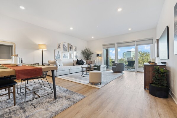 Modern open-concept living and dining area with ample natural light.