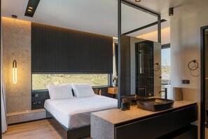 Master bedroom with a King-size bed and an ensuite bathroom