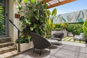 Our vibrant exterior is an invitation to unwind and explore. From the sparkling pool to the outdoor gym and whimsical signage, every detail is designed to delight.