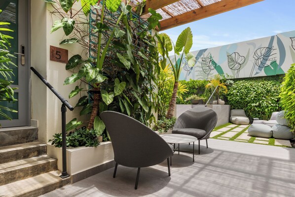 Indulge in outdoor luxury. Lounge by the pool, surrounded by lush greenery and adorable signage, or invigorate your senses in our alfresco gym.