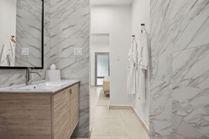 After a long day of exploring, unwind in comfort with a luxurious robe in the bathroom.