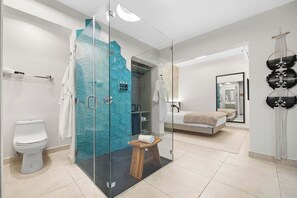 Clean and convenient private bathroom with a shower and toilet.