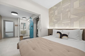 The perfect place to relax after a day of exploring, this bedroom features a luxurious king-size bed.