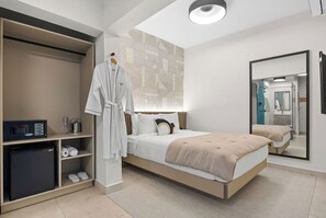 This inviting bedroom boasts a king-size bed for a restful night's sleep and a full-length mirror for checking your outfit.