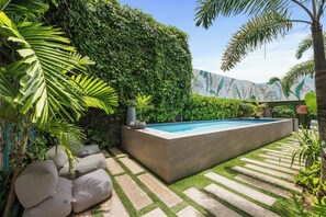 Immerse yourself in serenity as you relax by our pool, surrounded by calming gardens.