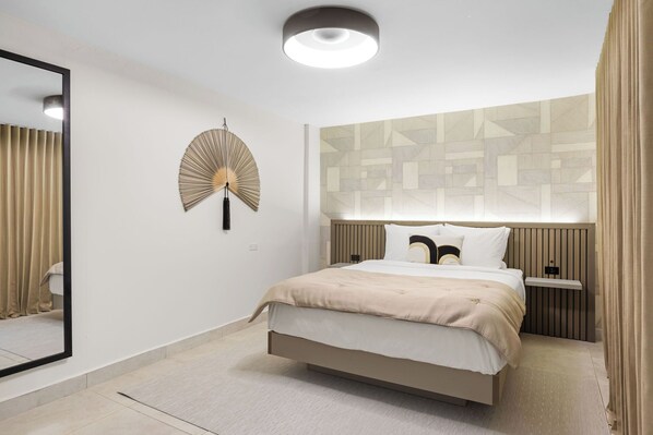 Modern headboard with warm wood accents adds a touch of elegance.