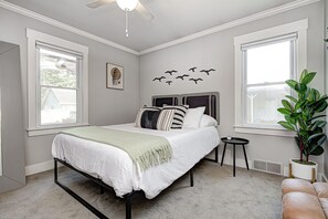 Main floor queen bedroom with privacy blinds