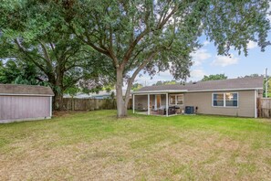 Step outside to discover a private and fenced backyard oasis. Ideal for gatherings and outdoor activities, this space is perfect for barbecues, picnics, or simply basking in the fresh air. 