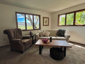 Den is a quiet retreat with a large smart TV. 