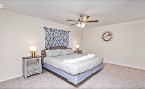 Master bedroom with king sized bed