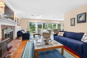 Comfortable living room with additional seating area near the sliding glass doors - 38 Monomoyic Way Chatham Cape Cod-Poppy's Place-NEVR