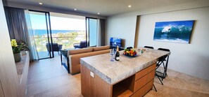 Modern kitchen with kitchen island, dishwasher, microwave, well equipped kitchen