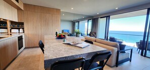 Modern kitchen with kitchen island, dishwasher, microwave, well equipped kitchen