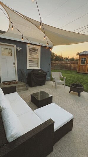 Patio for entertaining, full backyard with fence