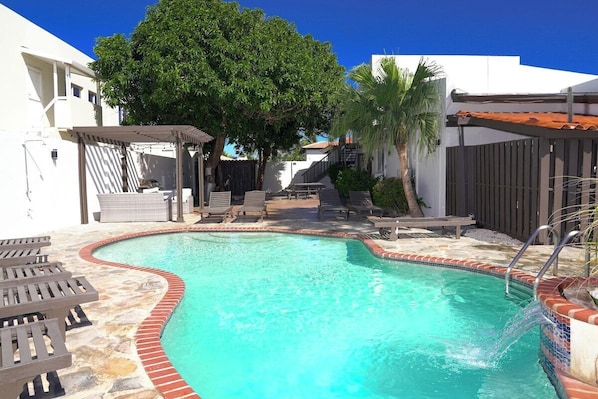 Dive into a new level of comfort as you soak up the sun-kissed vibes in this inviting backyard pool. Escape the hustle and bustle in style.