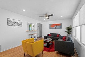 Vibrant & Cozy Living Room – Relax in this stylish, bright space with bold pops of color and modern decor.