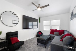 Entertainment Lounge – Kick back with a movie night in this sleek, comfy space with a giant TV.