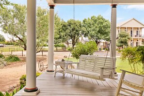 Experience ultimate relaxation on the inviting patio swing, nestled in the tranquil setting of The Country House.