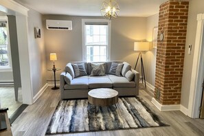 The family room has a sofa and flatscreen TV.