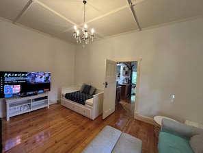 Lounge Area. Spacious. QLED 65in (Netflix, Play Station 5 Pro). Day Bed also.
