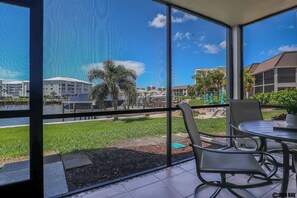 Take in the sea breezes out on your Screened In Lanai