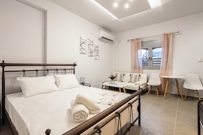 Bright Bedroom Area with Cozy Setup and Ample Natural Light