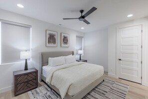 Main Bedroom - The main bedroom located on the main floor is furnished with a King bed, private TV, and closet.