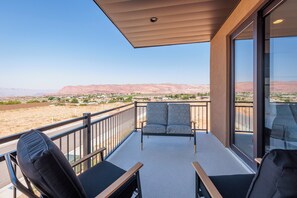 Bedroom Balcony - Read a book and enjoy the weather while you lounge around in comfort on the upstairs balcony.