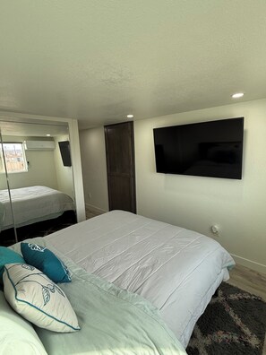 55” Smart TV at foot of bed