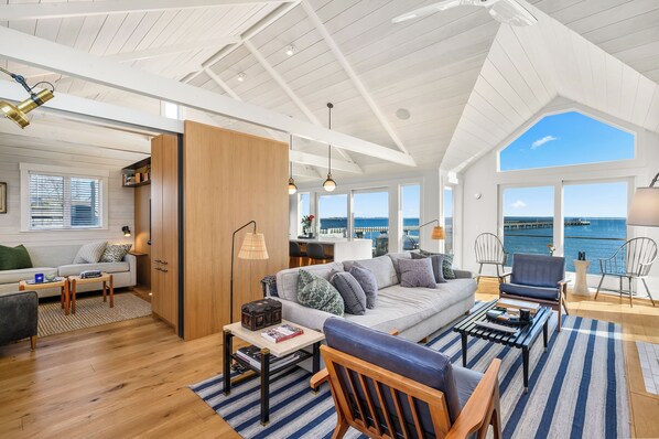 View of Living Room and Media Room/Den through to Kitchen and view of harbor