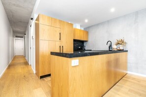 Step into the sleek modern kitchen, where contemporary design meets functionality. Featuring clean lines, high-quality appliances, and a minimalist aesthetic, this kitchen is perfect for both everyday cooking and entertaining.