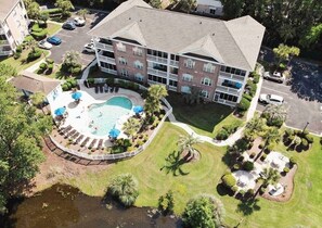 The condo is in the middle, on the 2nd floor, and overlooks the pool and pond. 