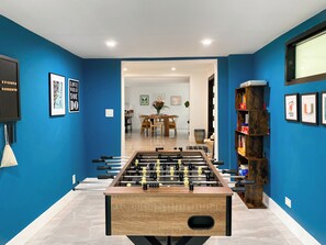 Game Room | Direct view into dining.