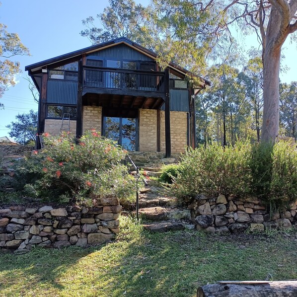 Back door opens to fire pit and short bush track to the river.