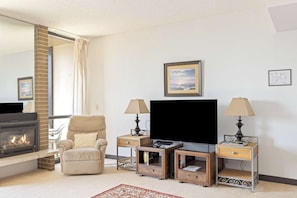 Warm up by the cozy gas fireplace! Perfect for relaxing with a good book after a day at the beach. Your comfy coastal retreat awaits!